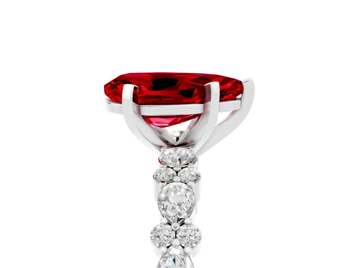 Pear Cut Ruby Side Stone Solitaire Ring with Round and Four-Prong Setting Silver