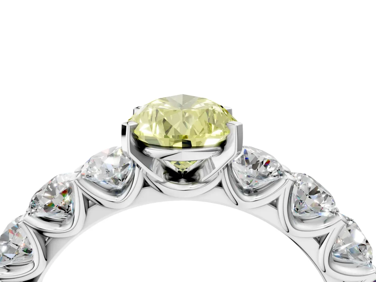 Fancy Yellow Pear Cut Diamond Prong Setting with Side Stones on a Pave Band Silver