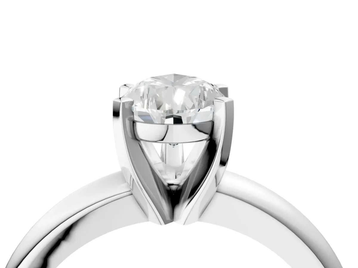 Pear Cut Diamond Solitaire Engagement Ring with Round Band and Four-Prong Setting Silver