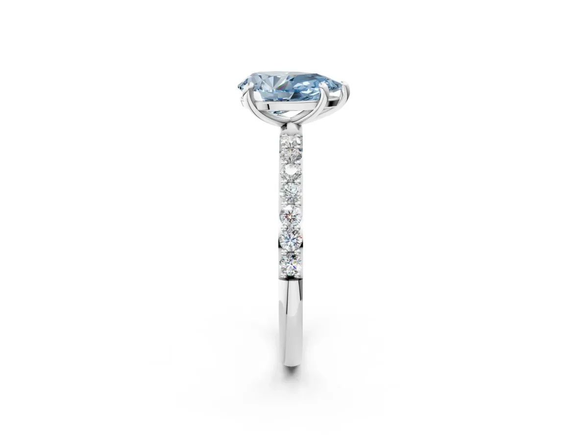 Fancy Blue Pear Cut Diamond Solitaire Ring with Round Pavé Band and Prong Setting Silver