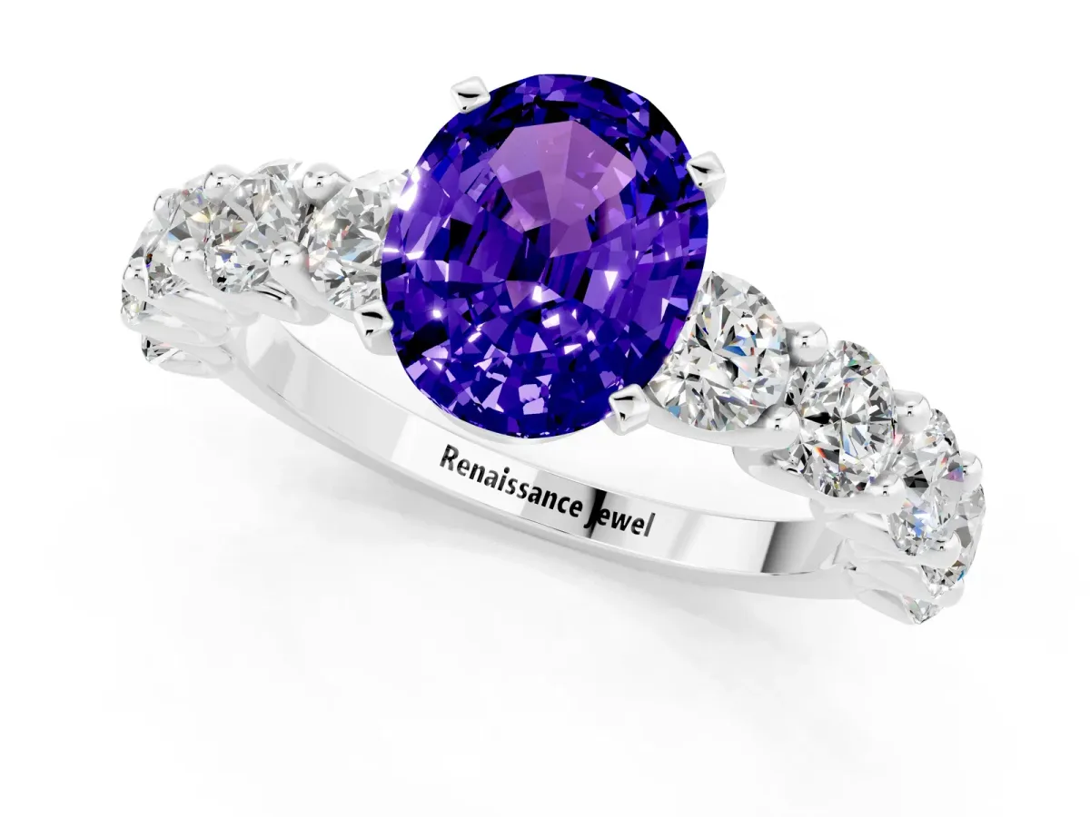 Oval Cut Tanzanite Prong Setting with Side Stones on a Pave Band Silver
