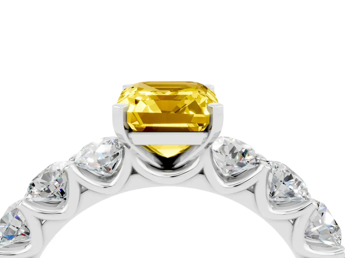 Emerald Cut Yellow Sapphire Prong Setting with Side Stones on a Pave Band Silver