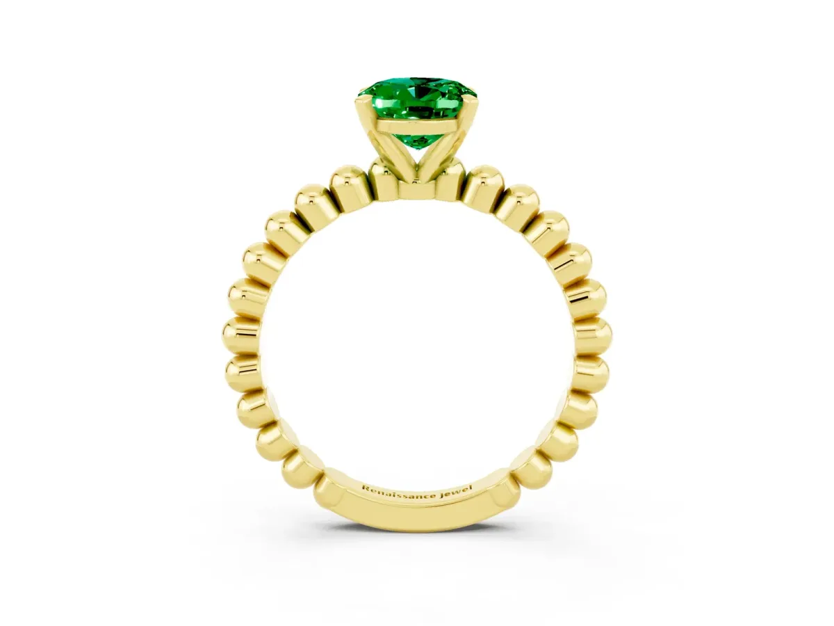 Oval Cut Emerald Solitaire Ring with Beaded Band and Prong Setting Yellow gold