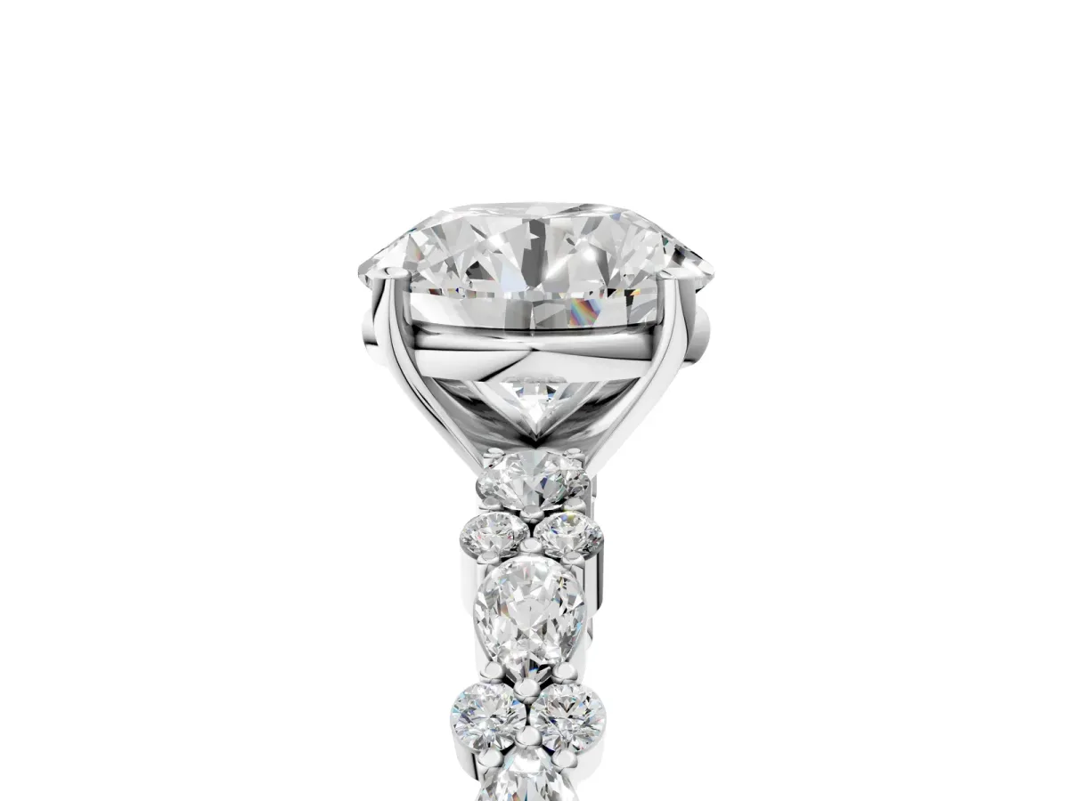 Round Cut Diamond Side Stone Solitaire Ring with Round and Four-Prong Setting White gold