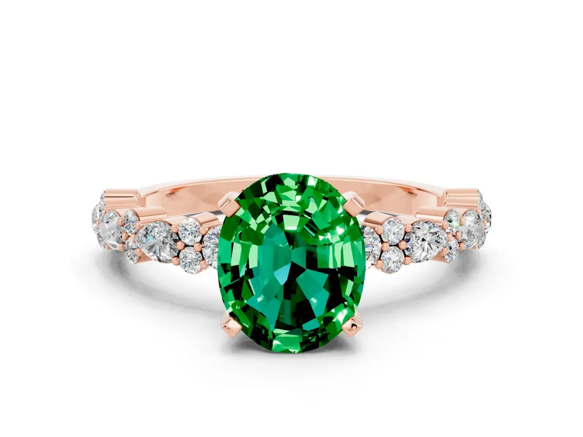 Oval Cut Emerald Side Stone Solitaire Ring with Round and Four-Prong Setting Rose gold