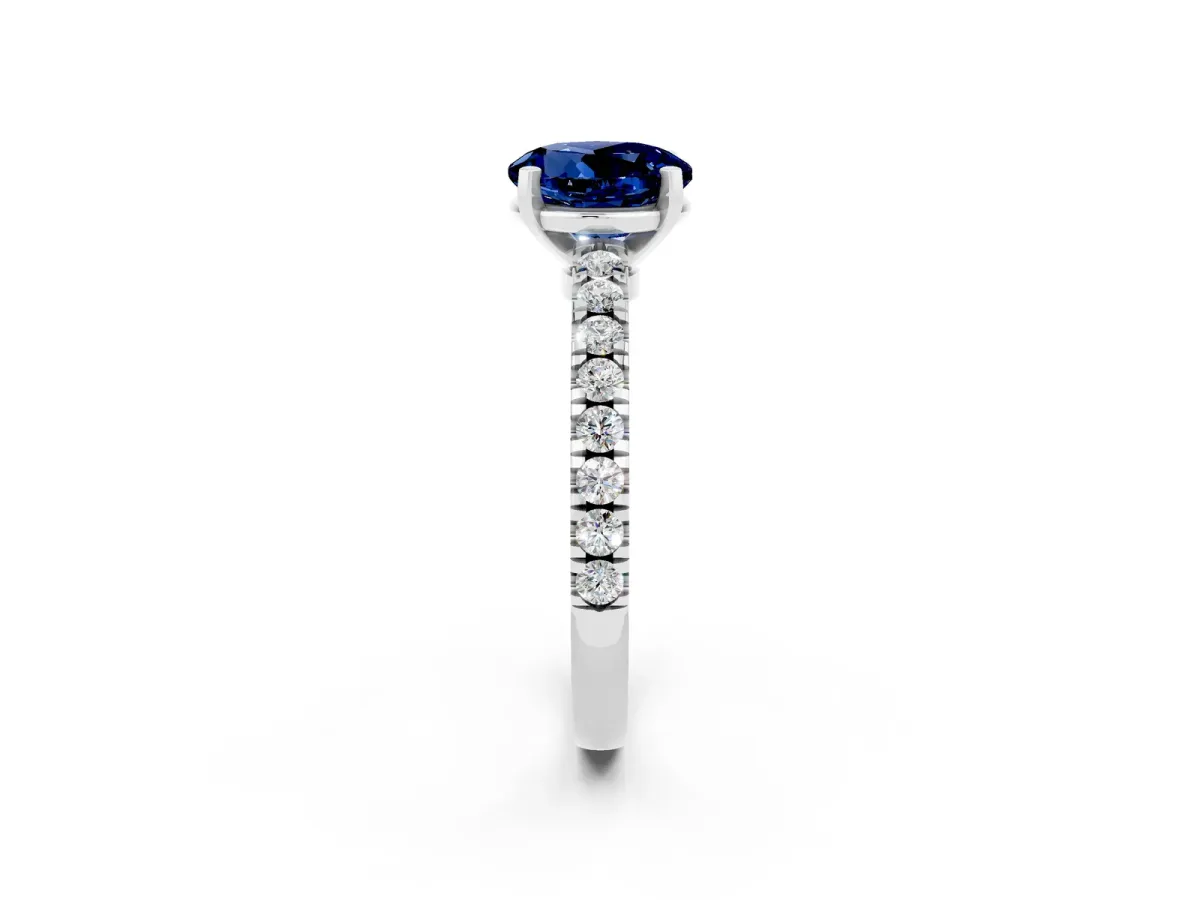 Round Cut Solitaire Blue Sapphire with Pavé Band and Four-Prong Setting Silver