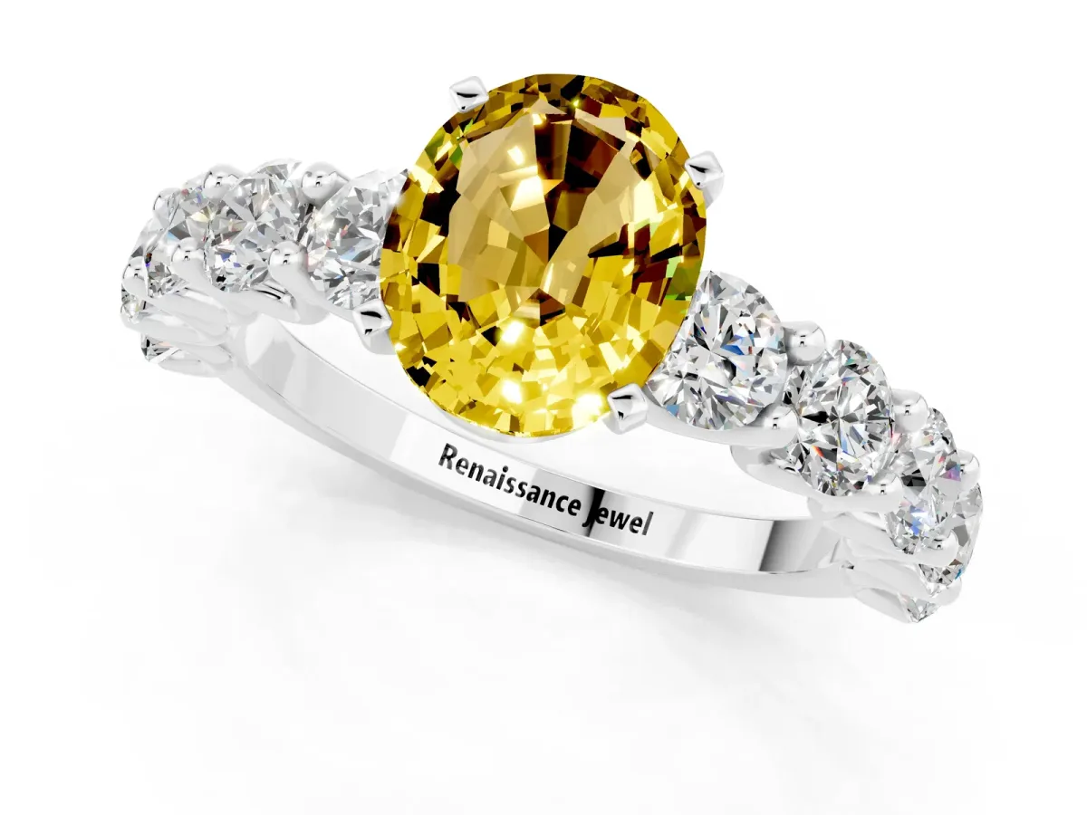 Oval Cut Yellow Sapphire Prong Setting with Side Stones on a Pave Band Silver