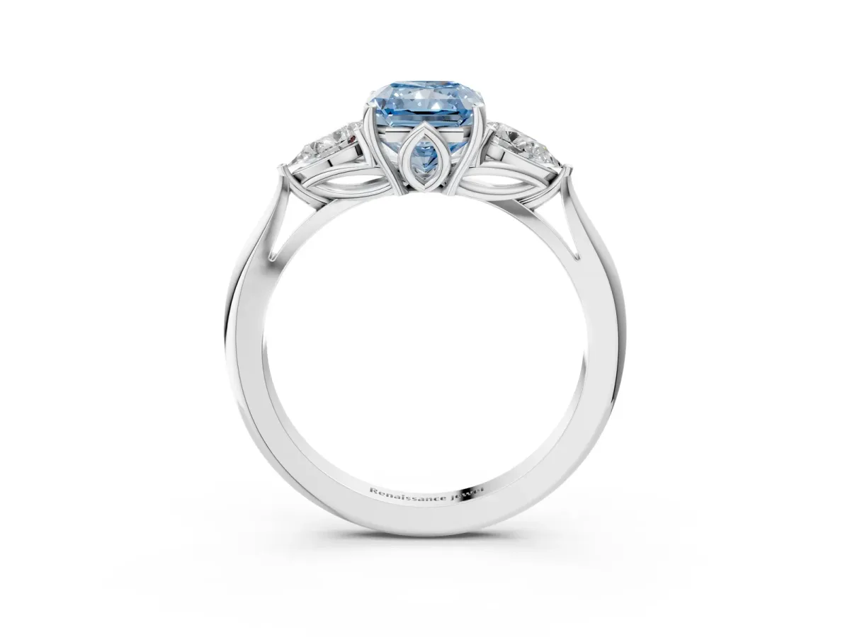 Fancy Blue Three-Stone Radiant Cut Diamond Ring with Pear Side Stones in Four-Prong Setting Platinum