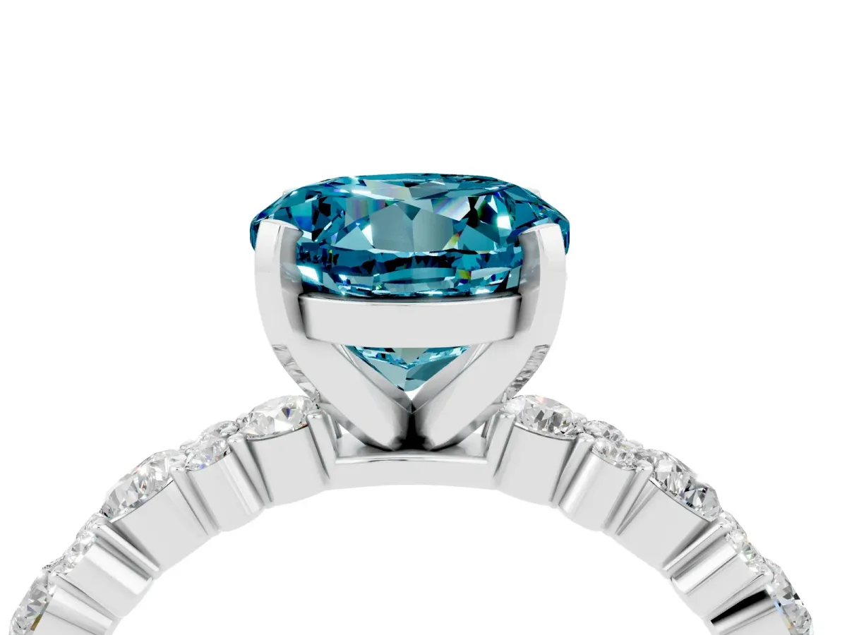 Round Cut Blue Topaz Side Stone Solitaire Ring with Round and Four-Prong Setting Silver