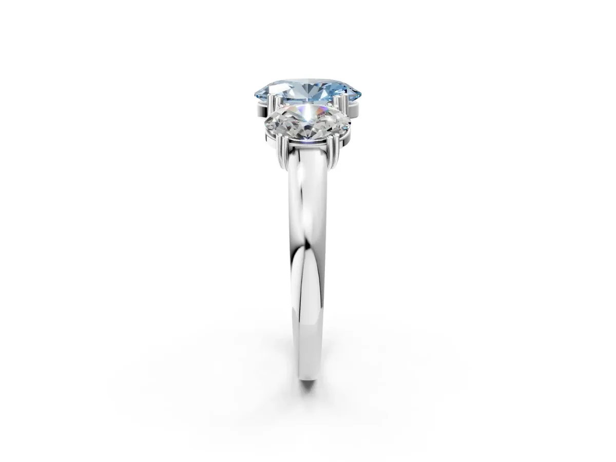 Fancy Blue Three-Stone Oval Cut Cut Diamond Ring with Channel Set Band and Four-Prong Setting Silver