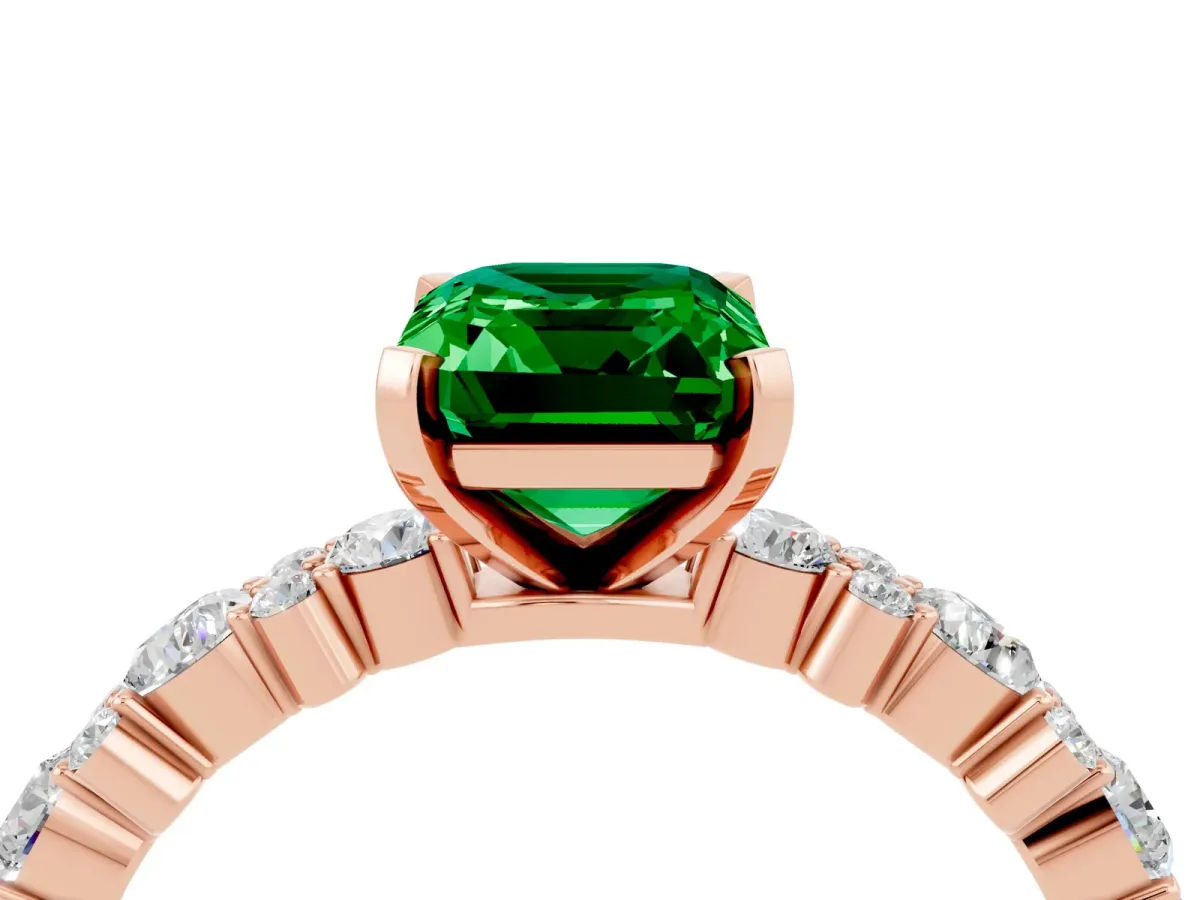 Emerald Cut Emerald Side Stone Solitaire Ring with Round and Four-Prong Setting Rose gold
