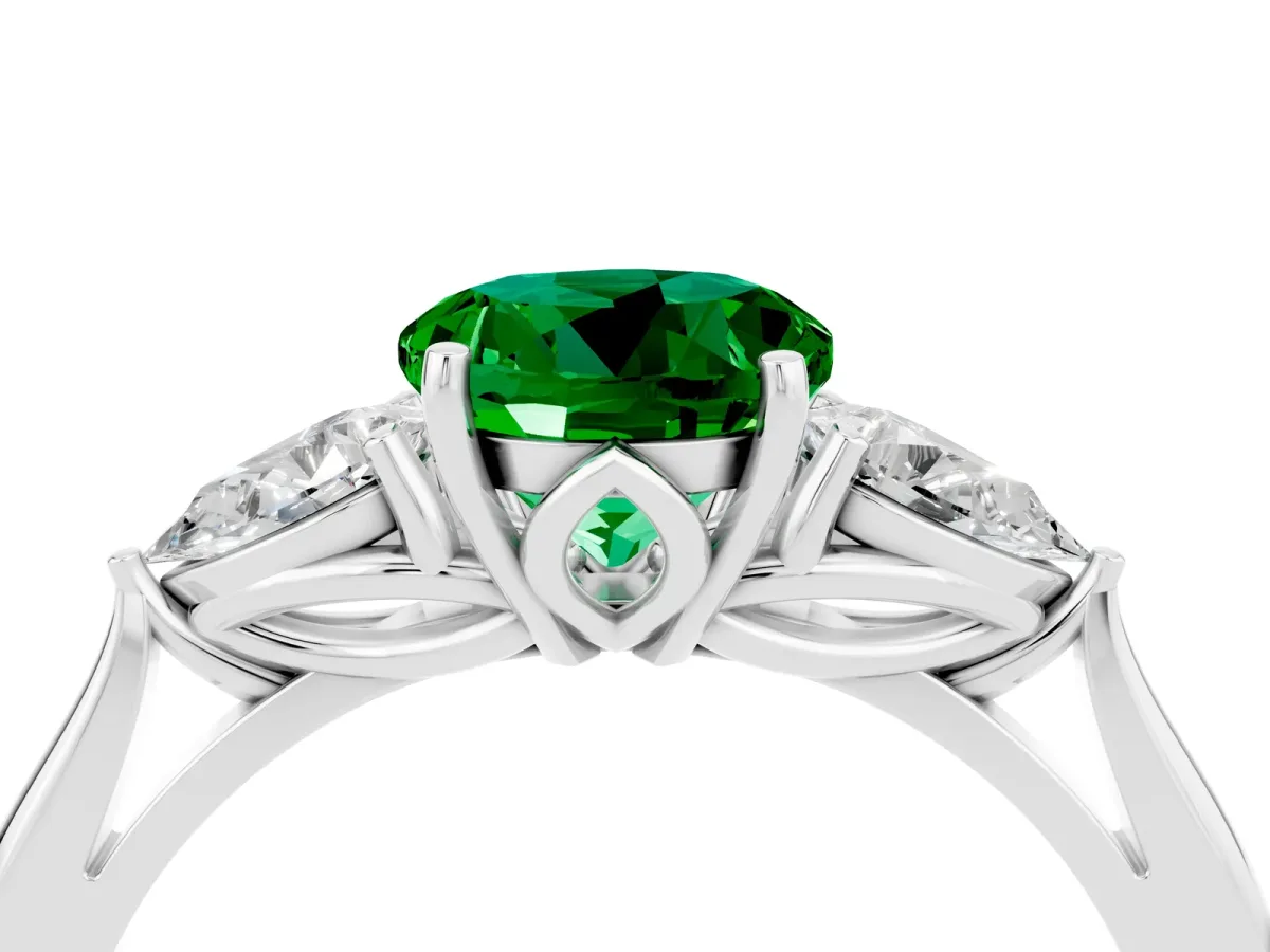 Three-Stone Round Cut Emerald Ring with Pear Side Stones in Four-Prong Setting Platinum
