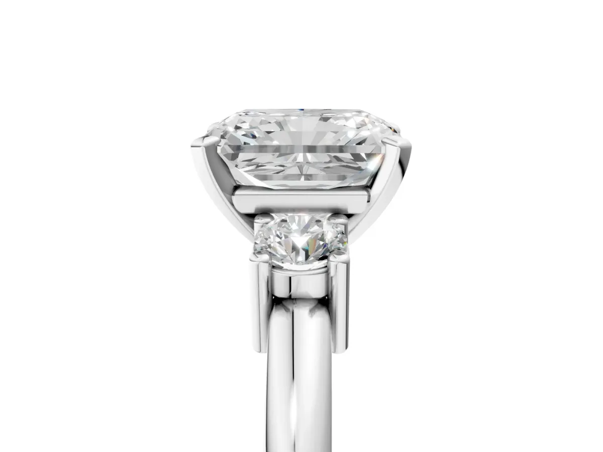 Three-Stone Radiant Cut Cut Diamond Solitaire with Prong Setting and Classic Band Platinum