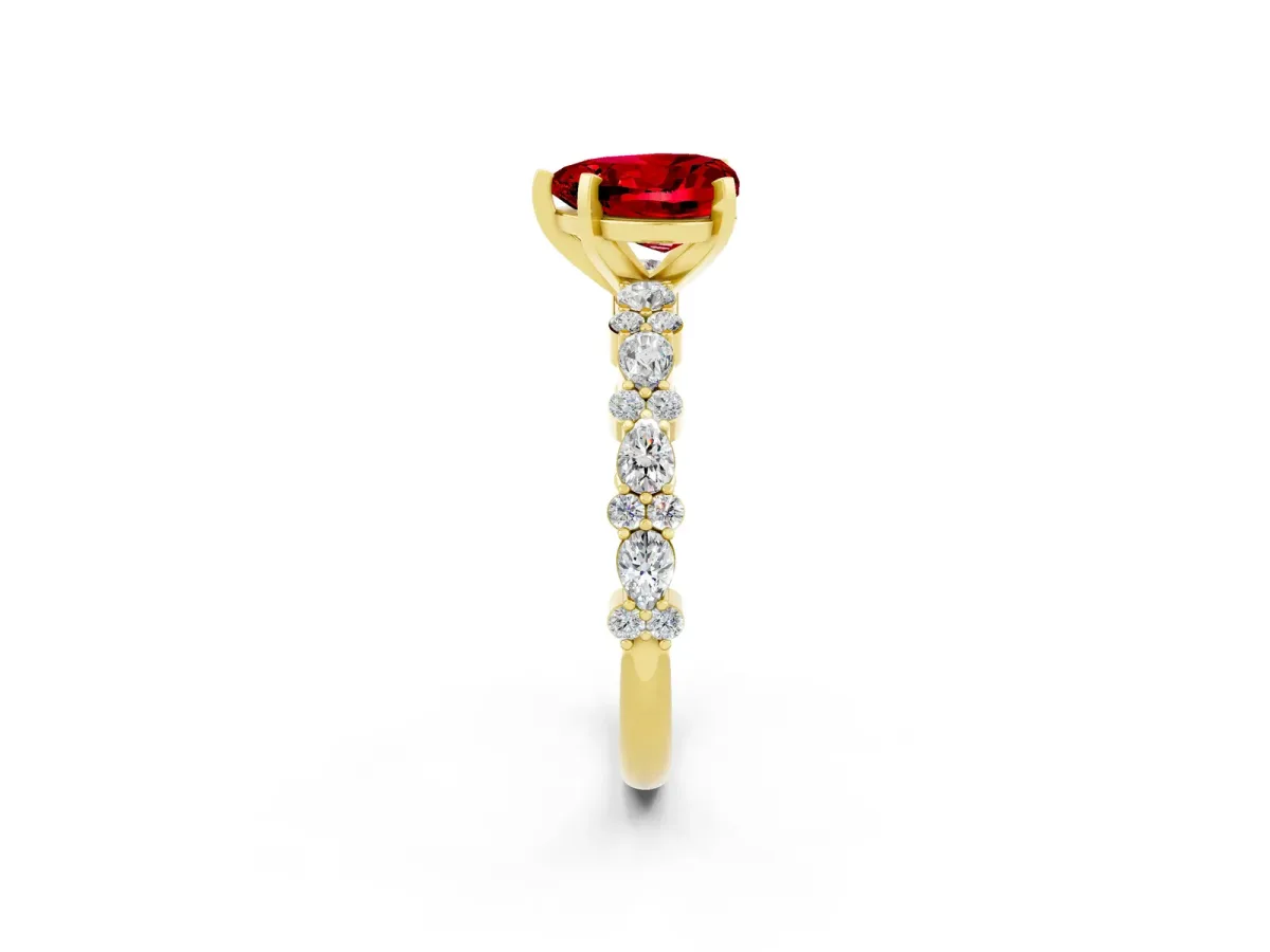 Heart Cut Ruby Side Stone Solitaire Ring with Round and Four-Prong Setting Yellow gold