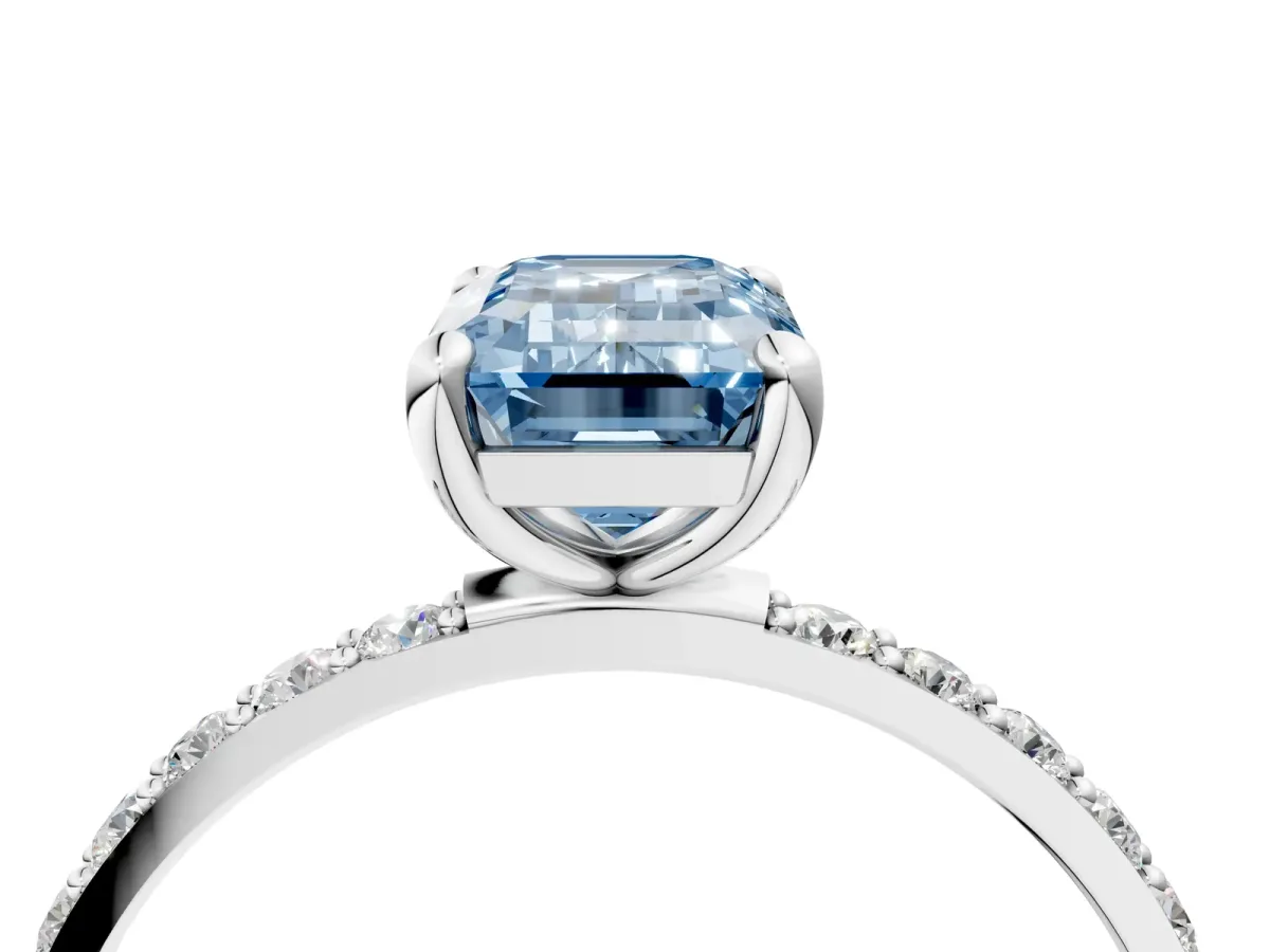 Fancy Blue Emerald Cut Diamond Solitaire Ring with Round Pavé Band and Prong Setting Silver