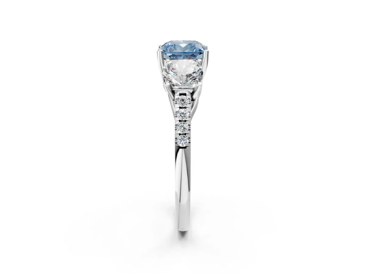 Fancy Blue Three-Stone Cushion Cut Diamond Ring with Round Pavé Band and Prong Setting Silver