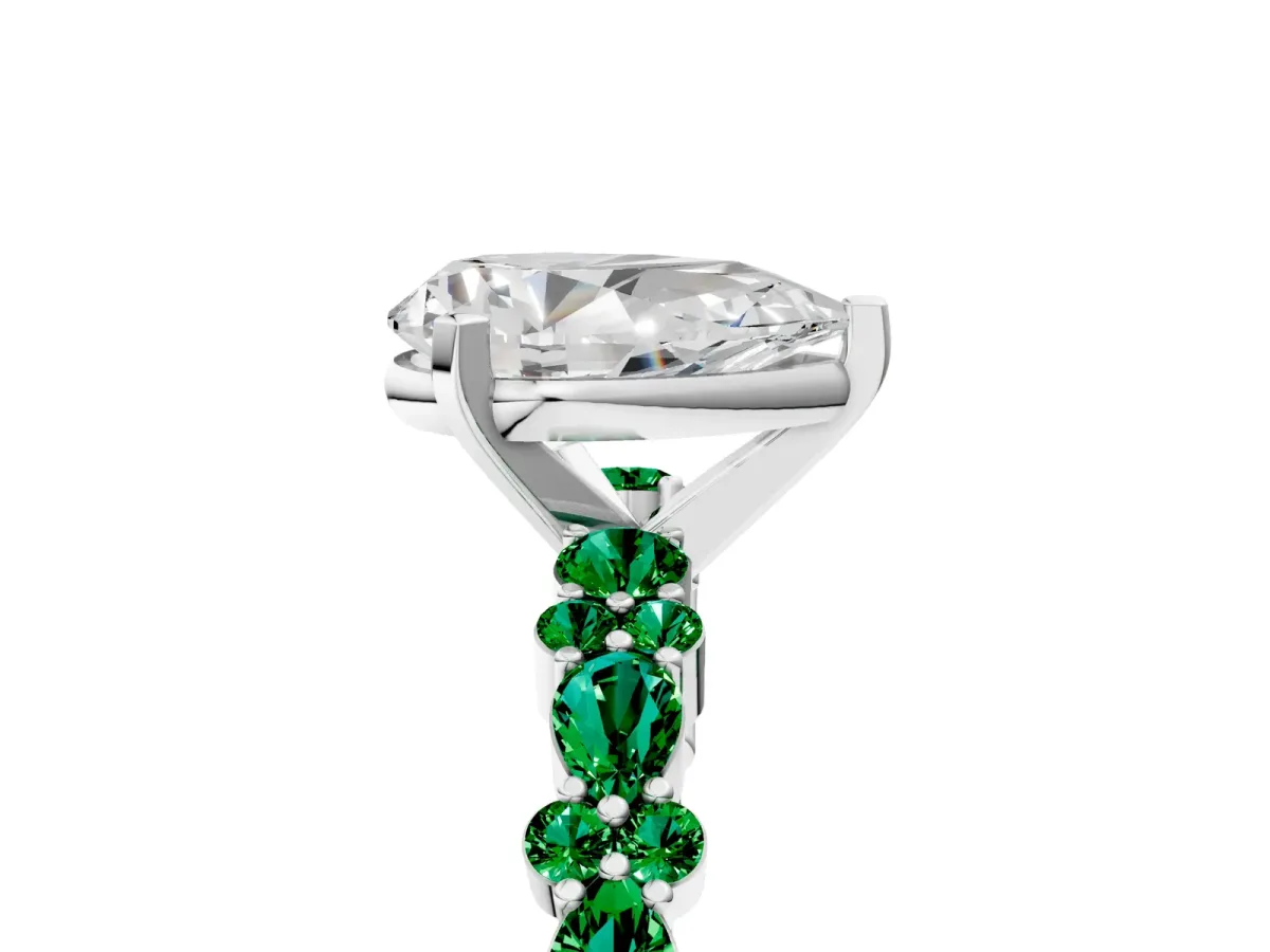 Pear Cut Diamond Side Stone Solitaire Ring with Round Emerald and Four-Prong Setting Silver