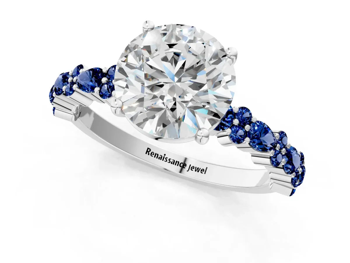 Round Cut Diamond Side Stone Solitaire Ring with Round Blue Sapphire and Four-Prong Setting Platinum