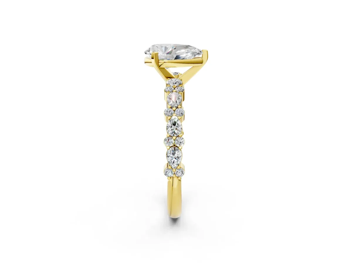 Pear Cut Diamond Side Stone Solitaire Ring with Round and Four-Prong Setting Yellow gold