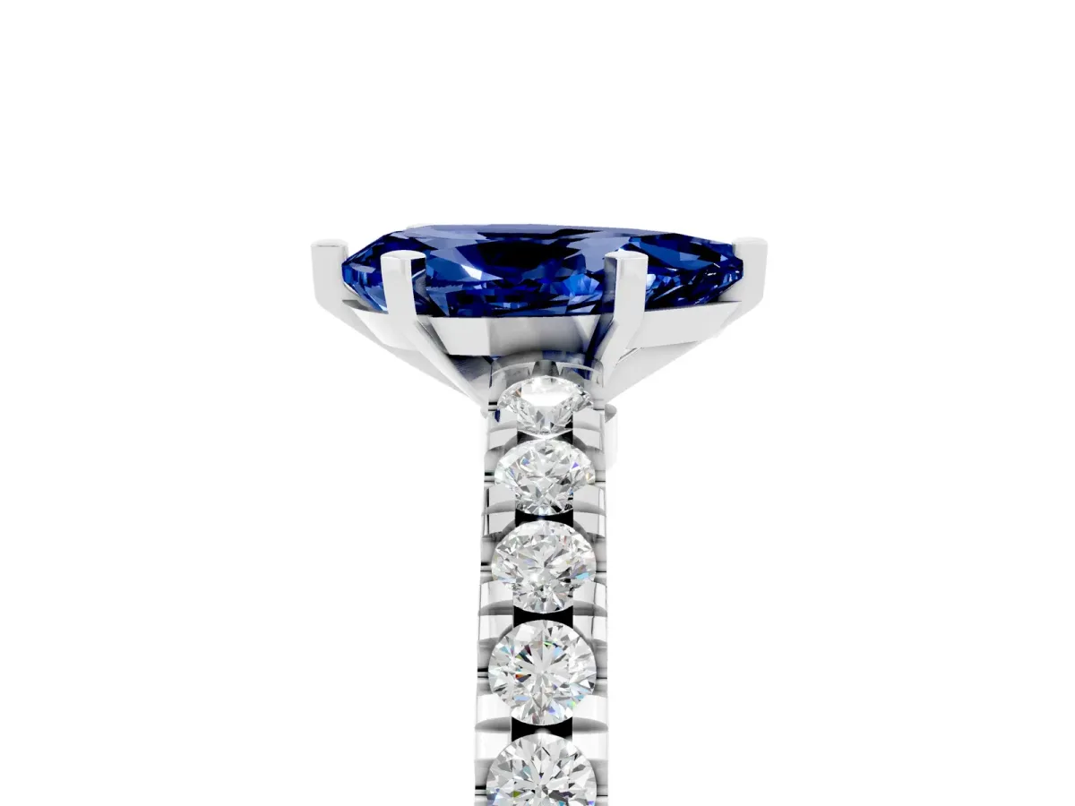 Pear Cut Solitaire Blue Sapphire with Pavé Band and Four-Prong Setting Silver