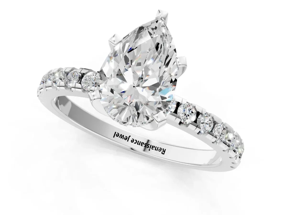 Pear Cut Diamond Solitaire Ring with Round Pavé Band and Four-Prong Setting Platinum