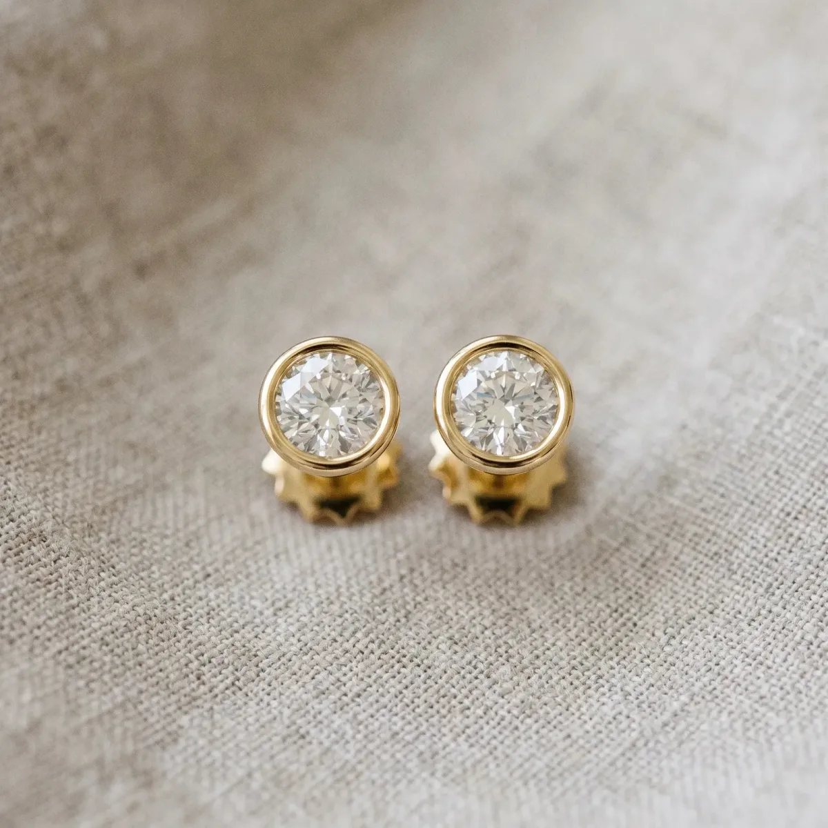 Bezel Set Round Diamond Stud Earrings with Push Back Yellow gold