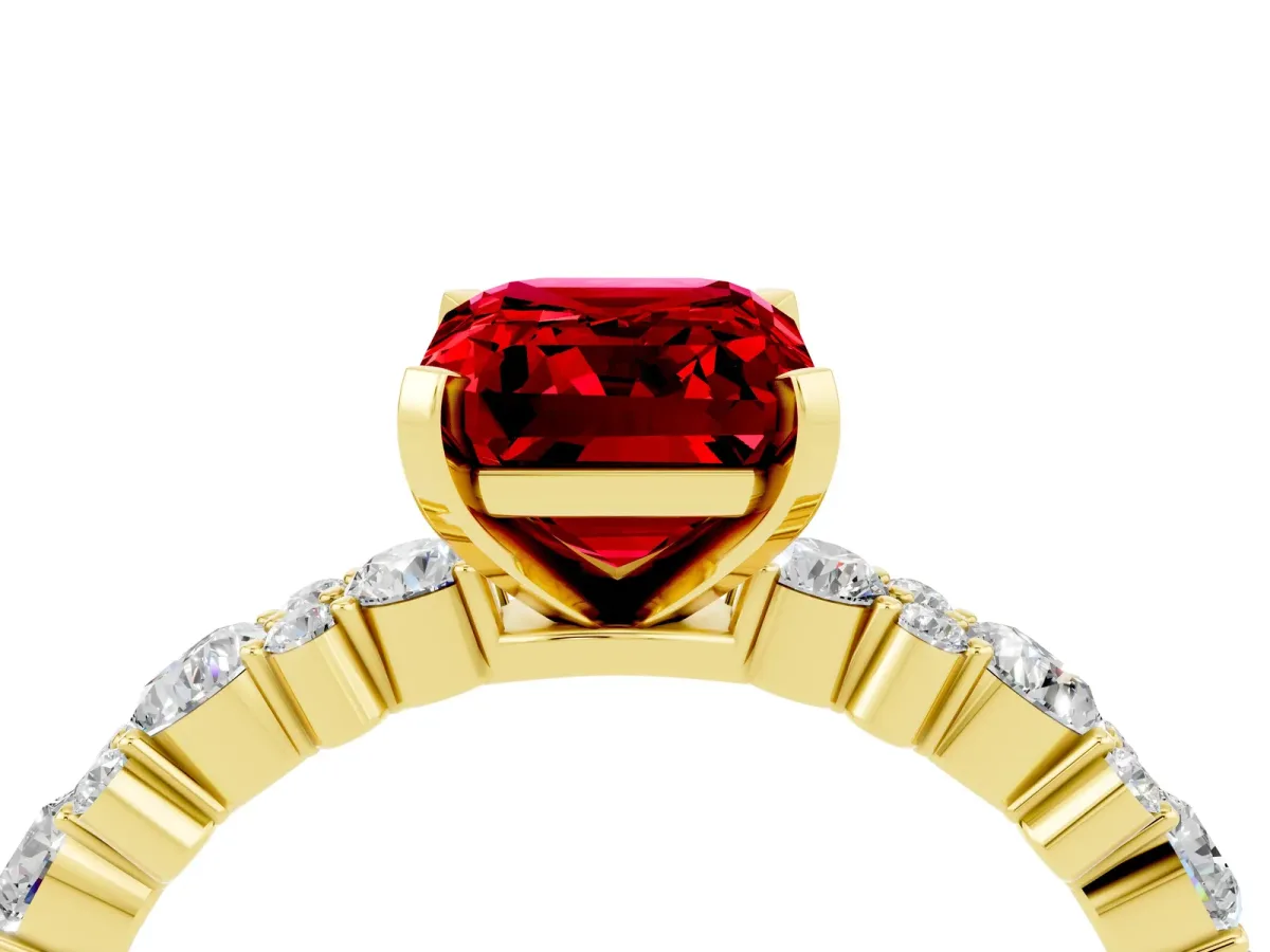 Emerald Cut Ruby Side Stone Solitaire Ring with Round and Four-Prong Setting Yellow gold