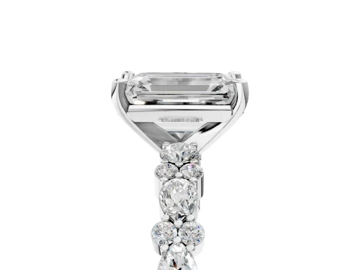 Emerald Cut Diamond Side Stone Solitaire Ring with Round and Four-Prong Setting White gold