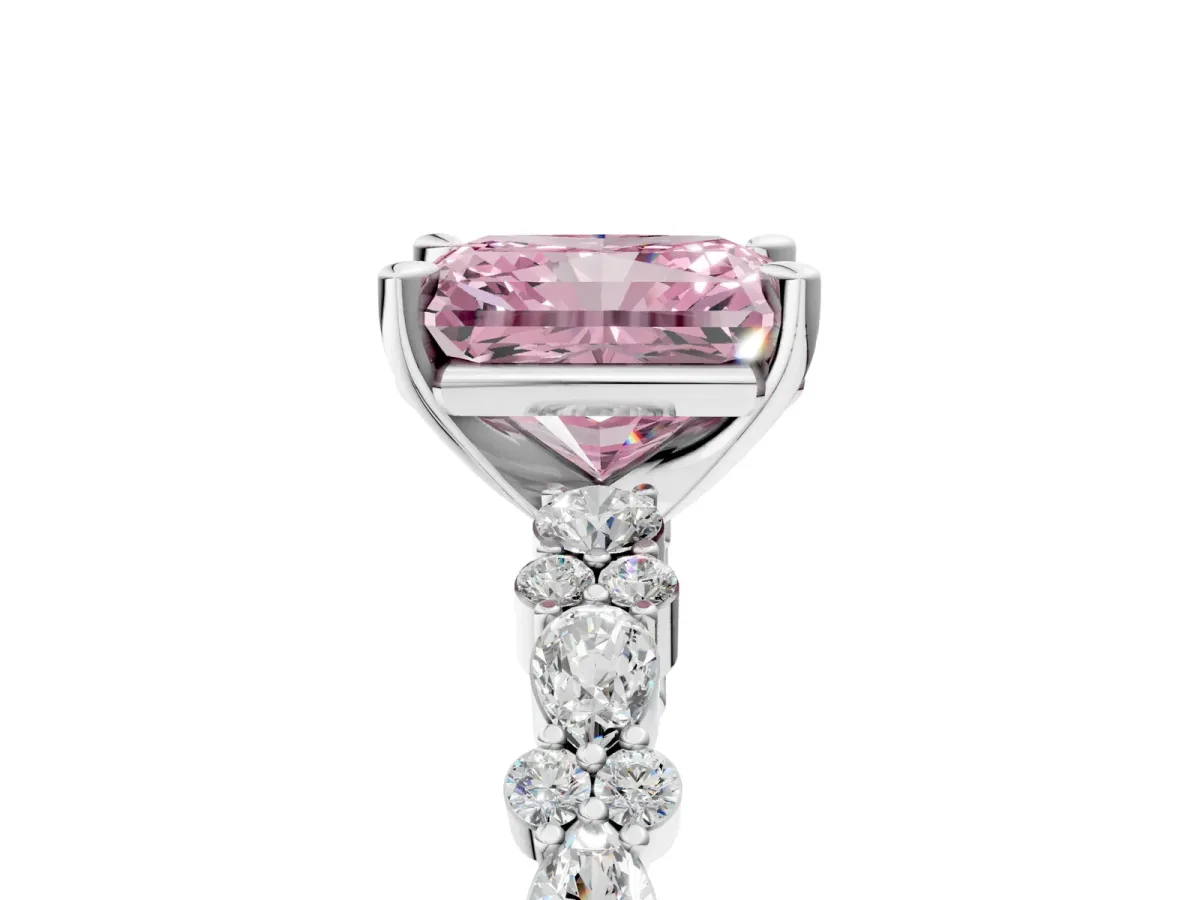Fancy Pink Radiant Cut Diamond Side Stone Solitaire Ring with Round and Four-Prong Setting Platinum