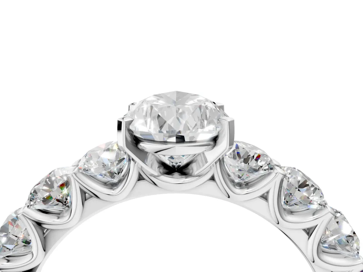 Pear Cut Diamond Prong Setting with Side Stones on a Pave Band Silver