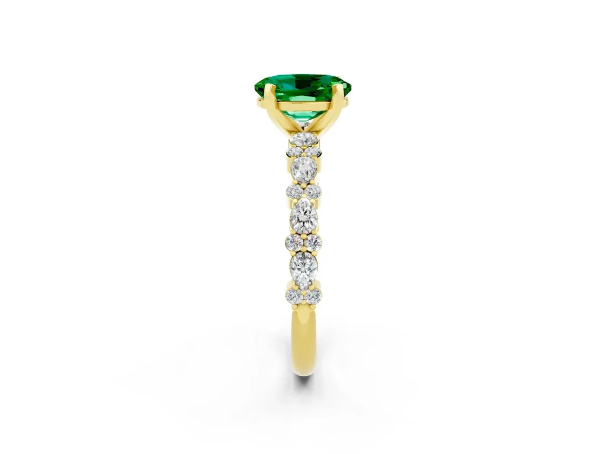 Oval Cut Emerald Side Stone Solitaire Ring with Round and Four-Prong Setting Yellow gold