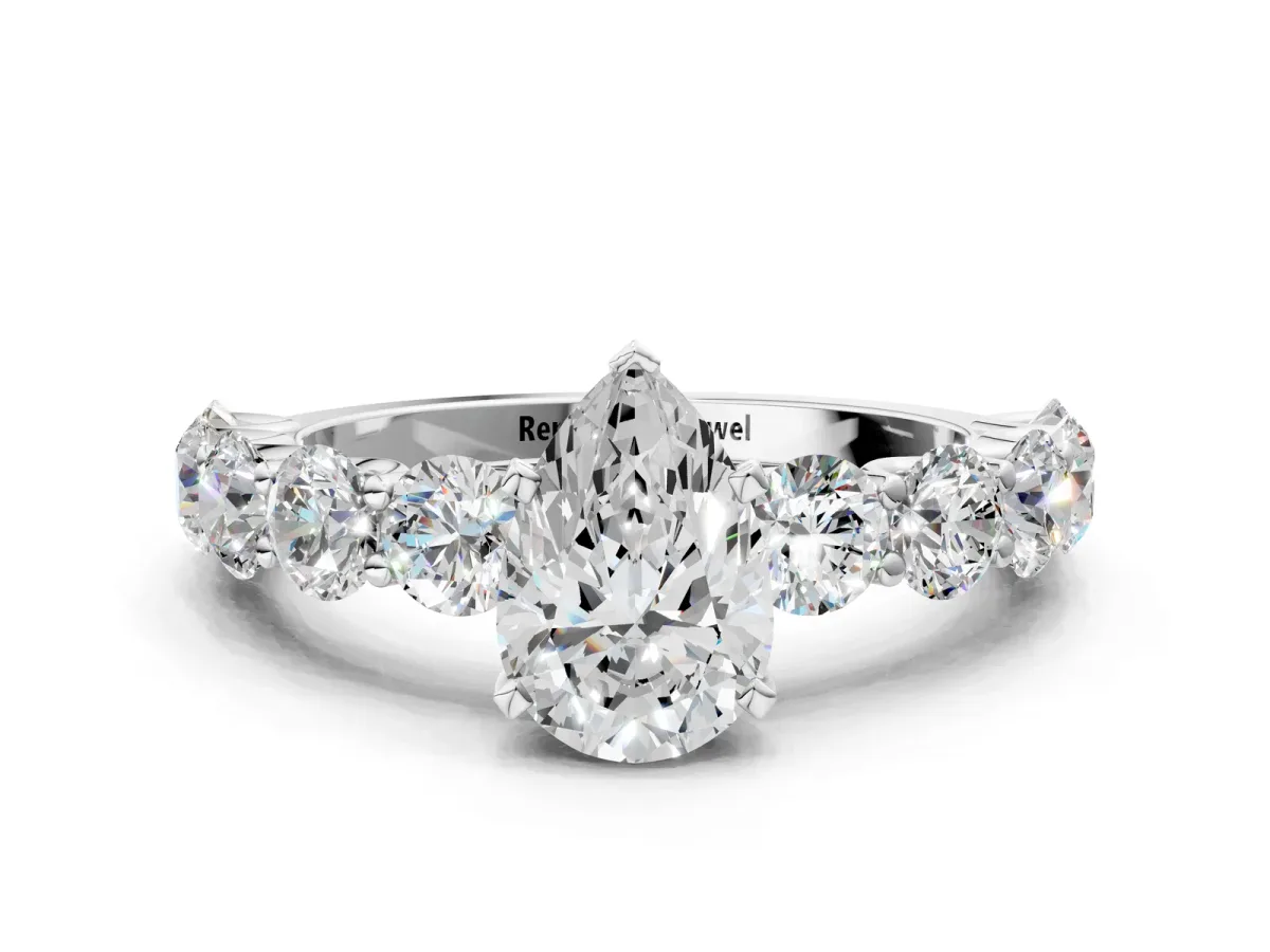 Pear Cut Diamond Prong Setting with Side Stones on a Pave Band Silver