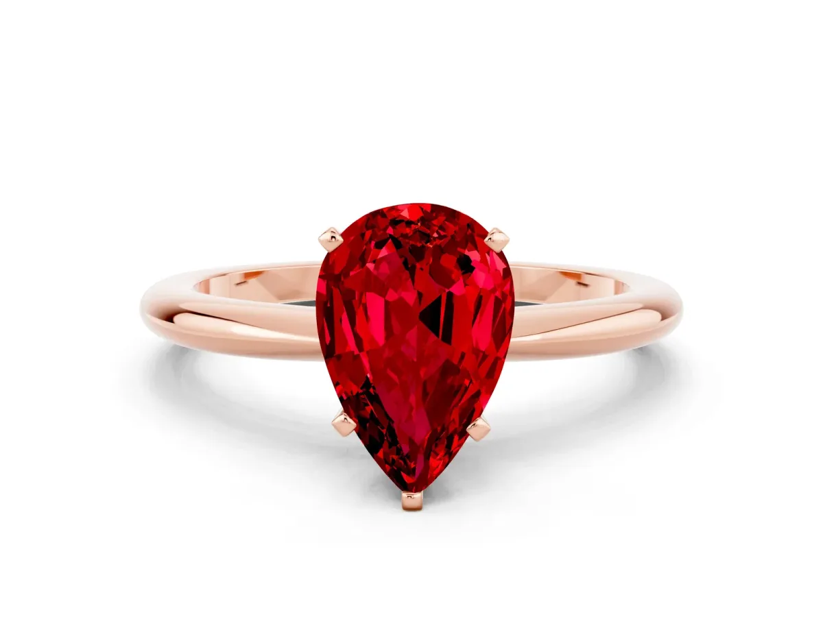 Pear Cut Ruby Solitaire Ring with Six-Prong Setting and Classic Band Rose gold