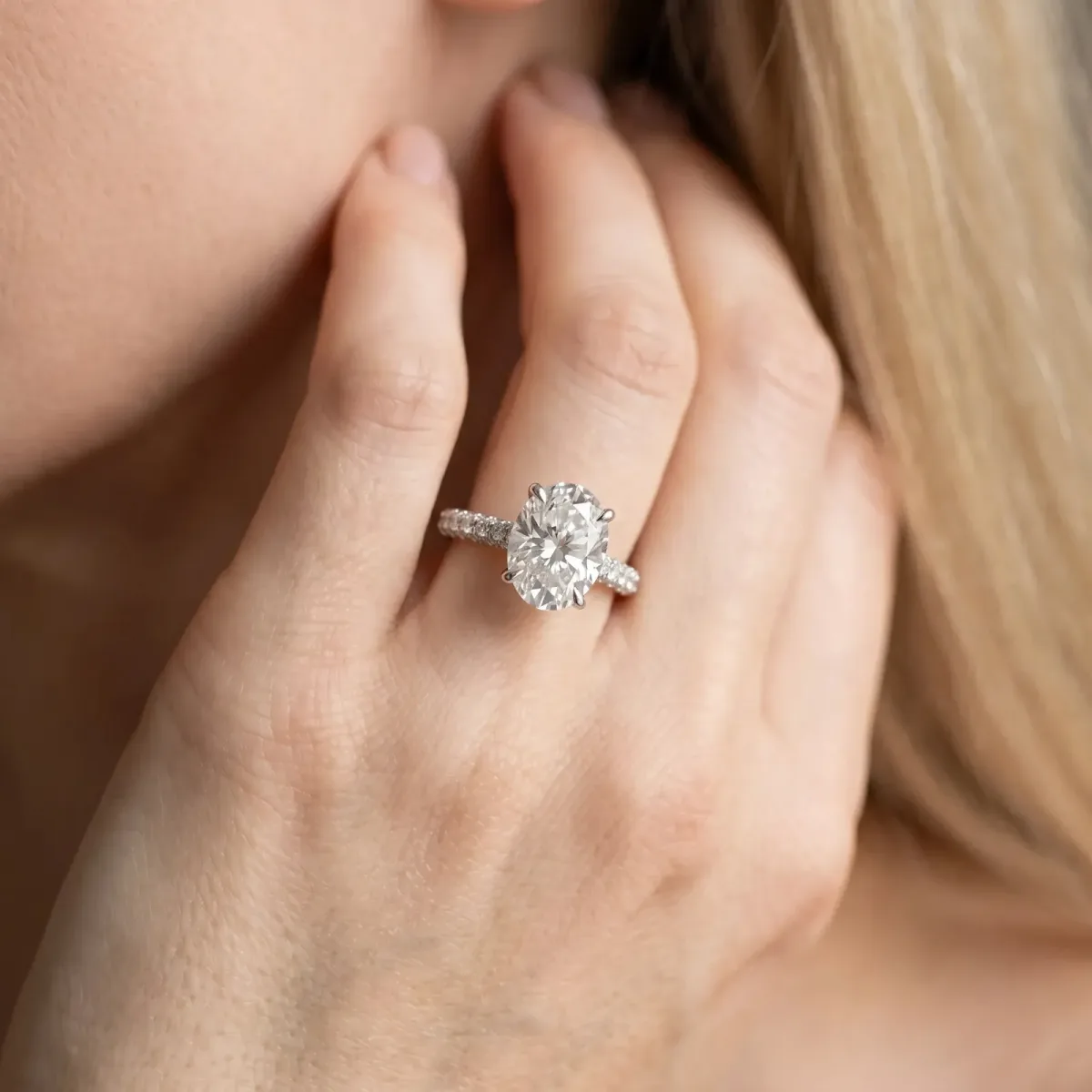 Oval Cut Diamond Solitaire Ring with Round Pavé Band and Prong Setting Silver