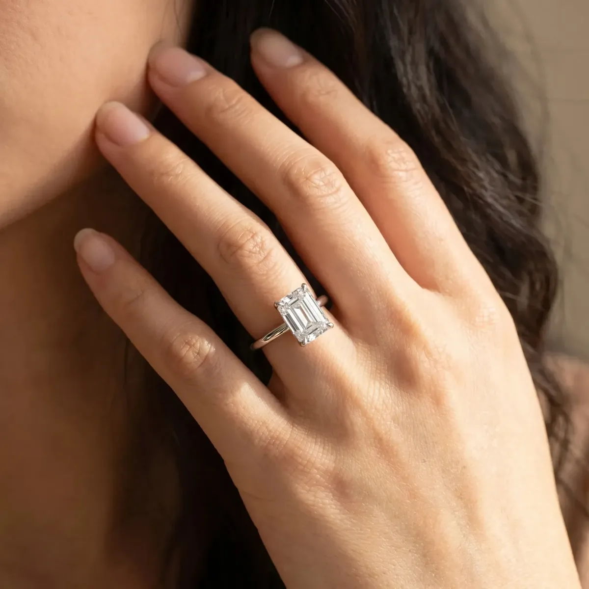 Emerald Cut Diamond Solitaire Ring with Thin Band and Four-Prong Setting White gold