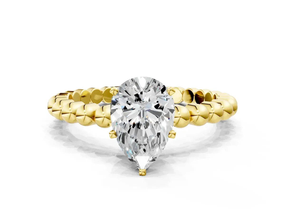 Pear Cut Diamond Solitaire Ring with Beaded Band and Prong Setting Yellow gold