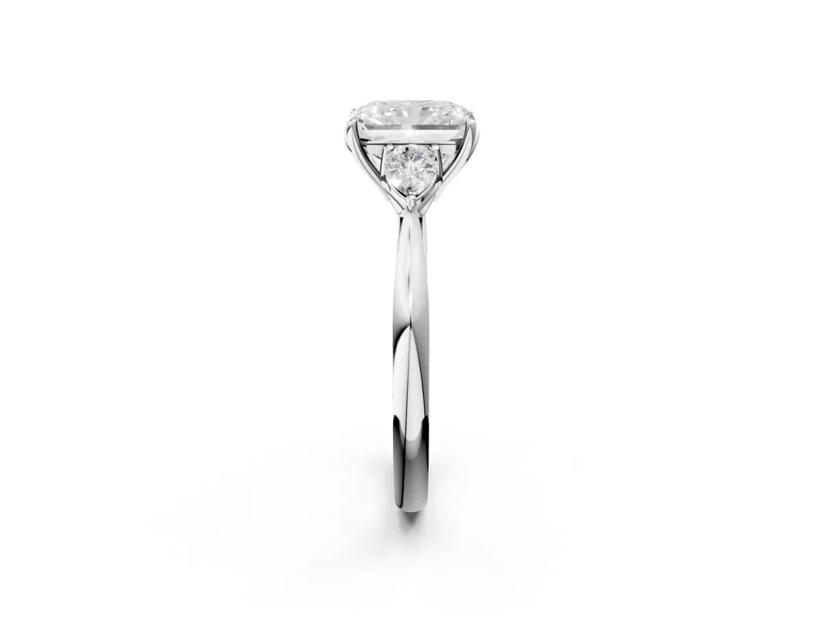 Three-Stone Radiant Cut Diamond Ring with Pear Side Stones in Four-Prong Setting Platinum