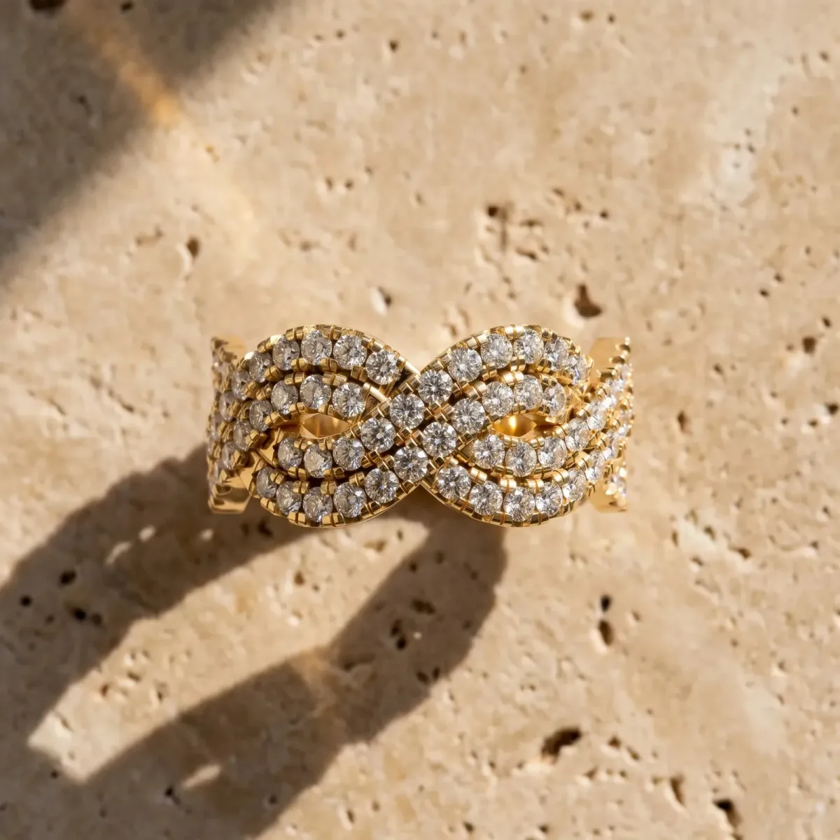 Pavé Round Diamond Infinity Twist Band with Shared Prong Setting Yellow gold