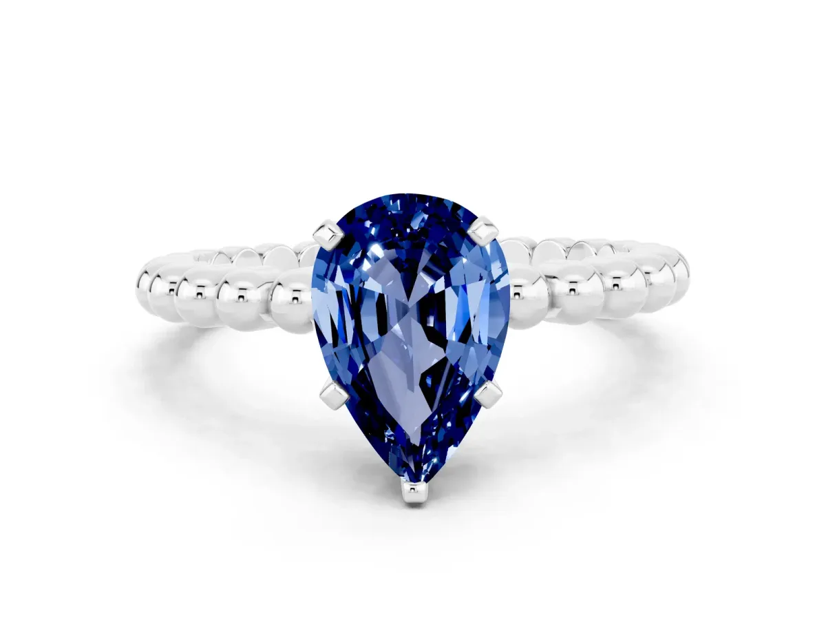 Pear Cut Blue Sapphire Solitaire Ring with Beaded Band and Prong Setting Silver