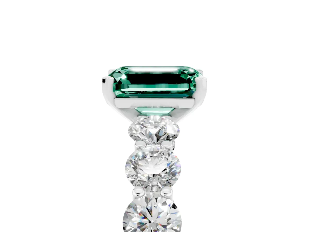 Emerald Cut Green Sapphire Prong Setting with Side Stones on a Pave Band Silver