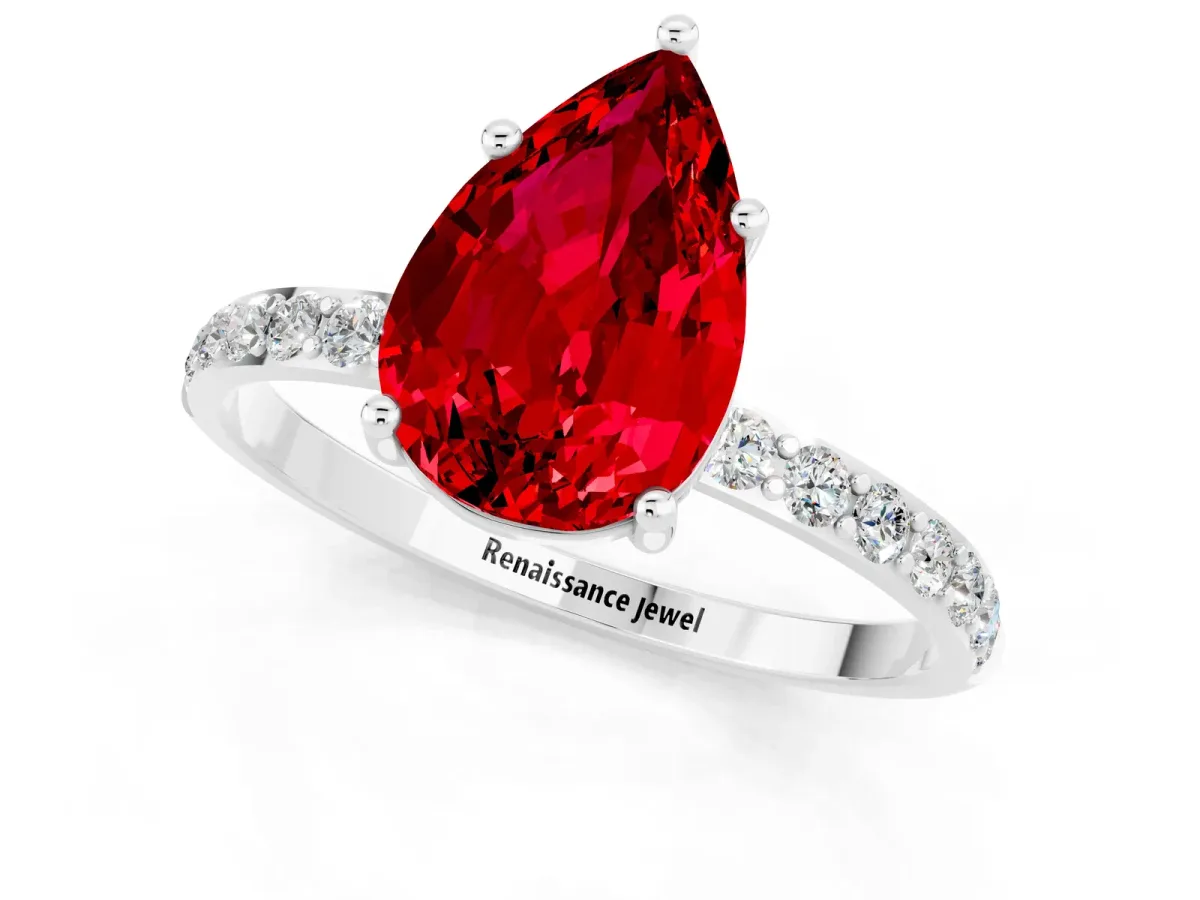 Pear Cut Ruby Solitaire Ring with Round Pavé Band and Prong Setting Silver