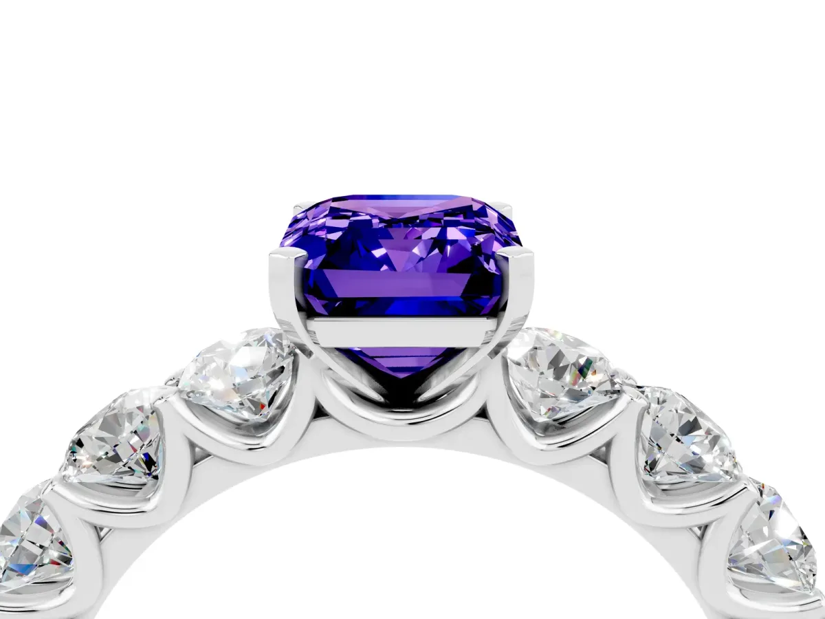 Emerald Cut Tanzanite Prong Setting with Side Stones on a Pave Band Silver