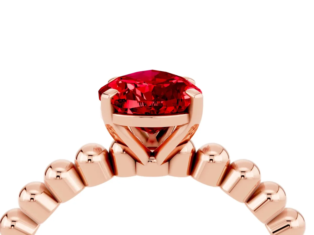 Pear Cut Ruby Solitaire Ring with Beaded Band and Prong Setting Rose gold