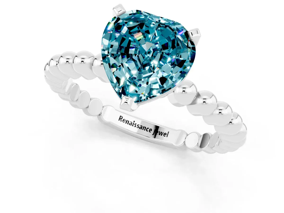 Heart Cut Blue Topaz Solitaire Ring with Beaded Band and Prong Setting Silver