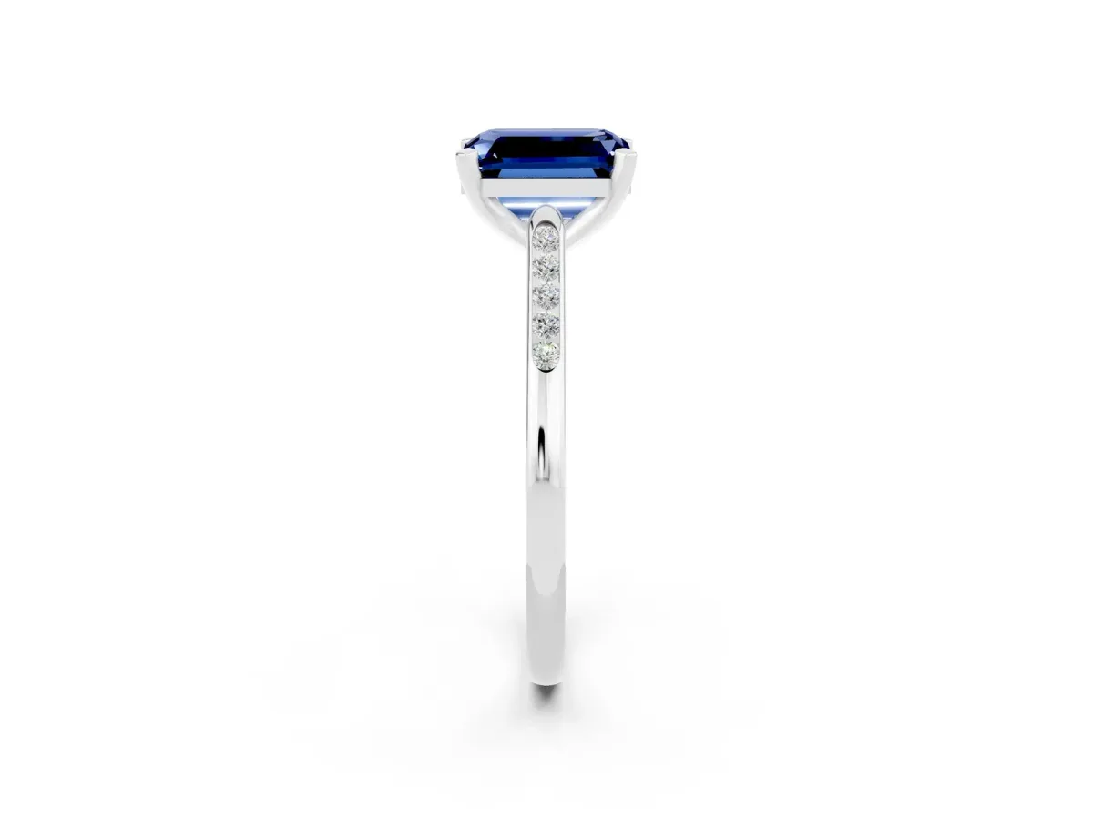 Emerald Cut Blue Sapphire Solitaire Ring with Channel Set Round Band and Prong Setting Silver