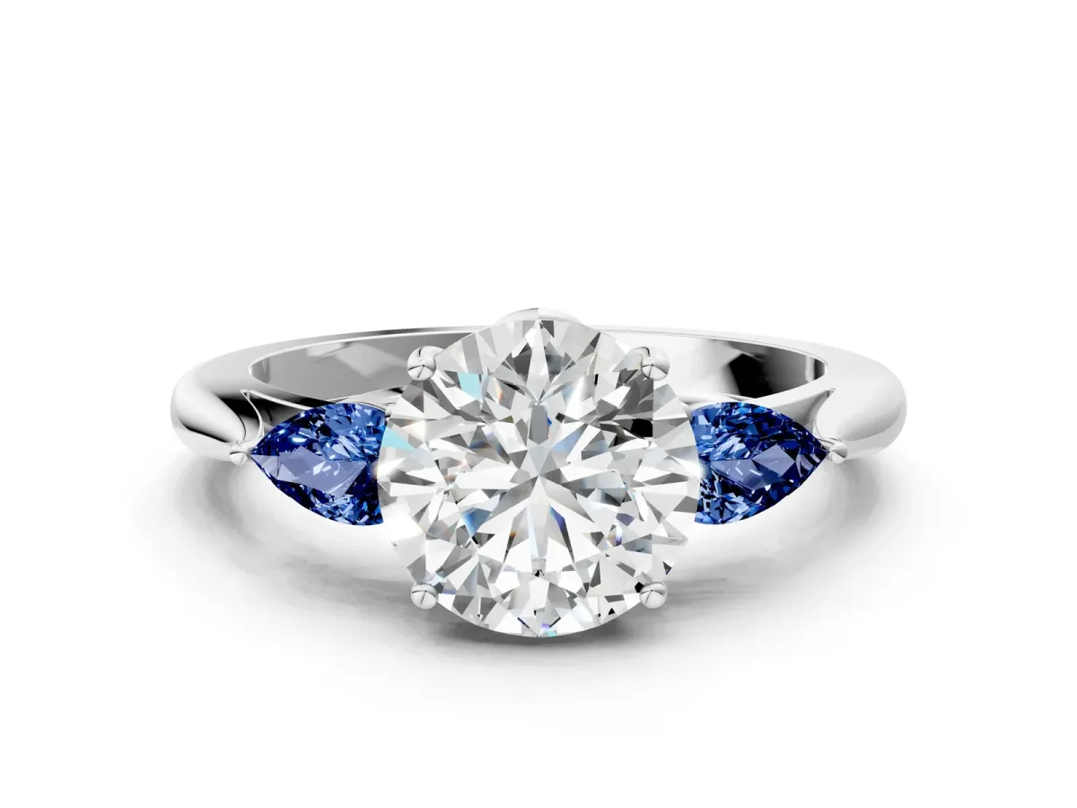 Round Cut Diamond Three-Stone Ring with Pear Blue Sapphire Side Stones and Prong Setting Silver
