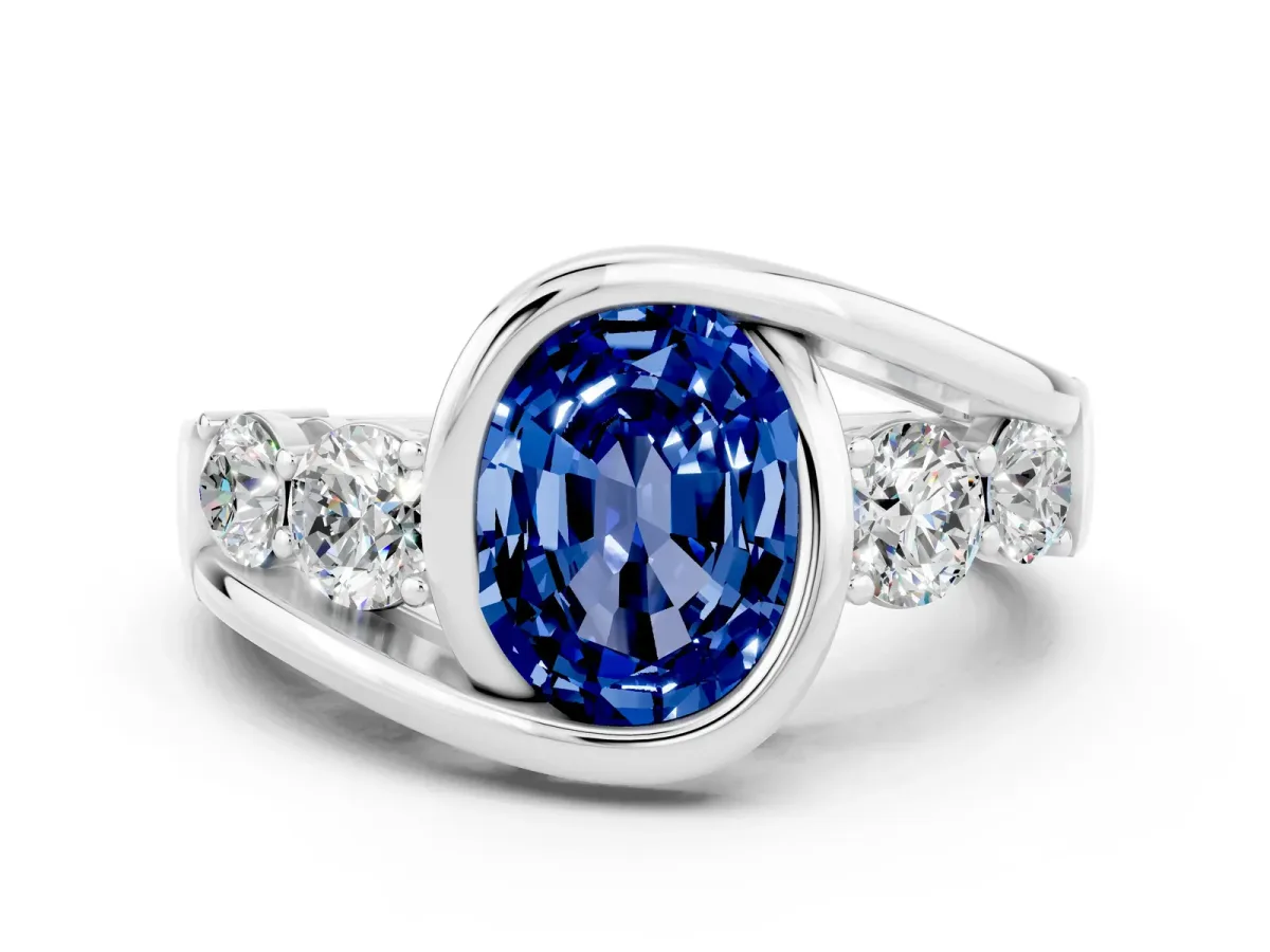 Bezel Set Oval Cut Blue Sapphire Bypass Ring with Round Accents Platinum