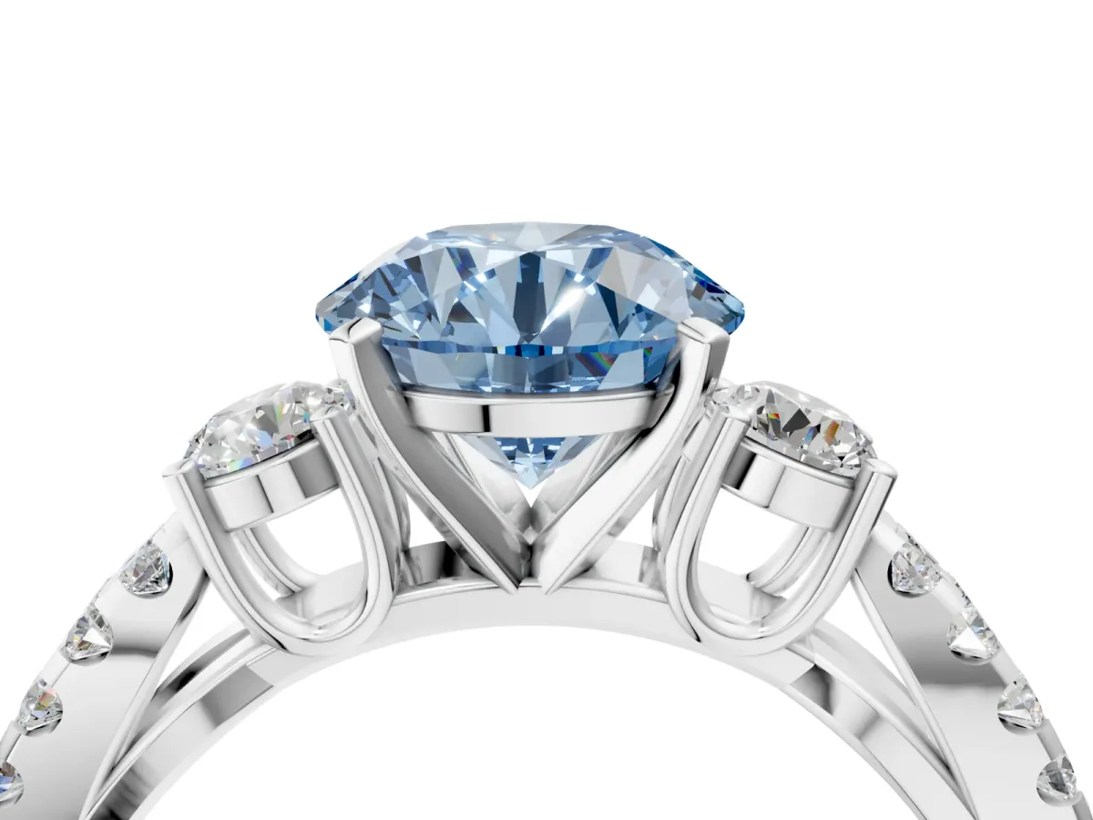 Fancy Blue Round Cut Diamond Three-Stone Ring with Pavé Split Shank and Four-Prong Setting Silver