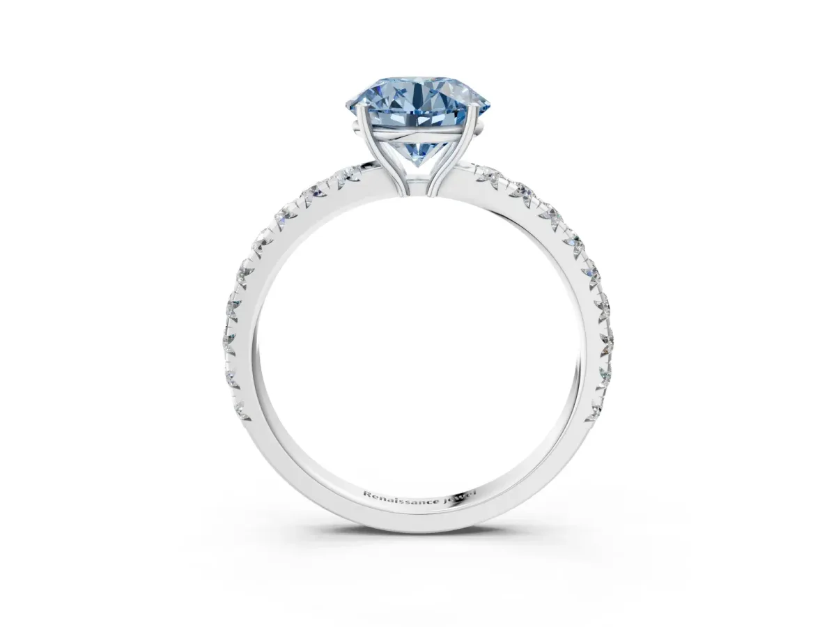 Fancy Blue Round Cut Diamond Pavé Solitaire Engagement Ring with Four-Prong Setting Silver