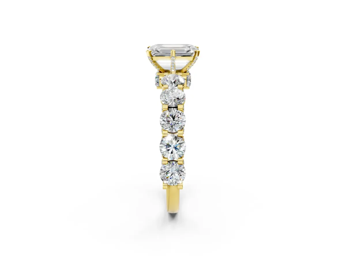 Emerald Cut Diamond Side Stone Engagement Ring with Four-Prong Setting Yellow gold